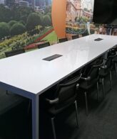 8029a5bc d1c5 4be0 bf0d 33b02305892d scaled 1 Gloss White Boardroom Table 4800mm x 1200mm - Gloss white boardroom table with steel frame legs, with two modern powerdock,16 to 18 seater