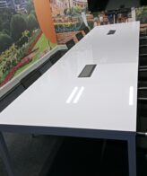 b012b5c9 0514 46d3 be0f c68919a99056 scaled 1 Gloss White Boardroom Table 4800mm x 1200mm (No Power Dock) - Gloss white boardroom table with steel frame legs, (No powerdock),16 to 18 seater